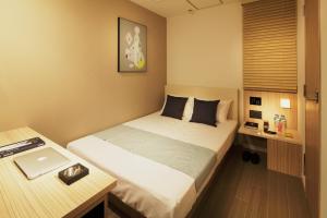Postel nebo postele na pokoji v ubytování Hotel UNO Nishikawaguchi Nishiguchi