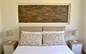 A bed or beds in a room at Modarno Exclusive Apartments