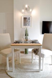 A television and/or entertainment centre at Modarno Exclusive Apartments