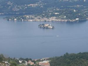 an island in the middle of a large body of water at The Horse in Pogno