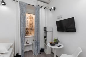 TV a/nebo společenská místnost v ubytování Guest House Tomasi One