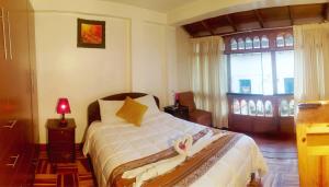 Postel nebo postele na pokoji v ubytování Hostal Comarca Imperial