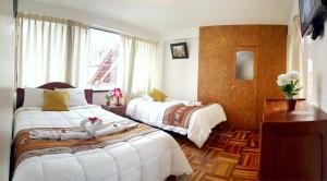 Postel nebo postele na pokoji v ubytování Hostal Comarca Imperial