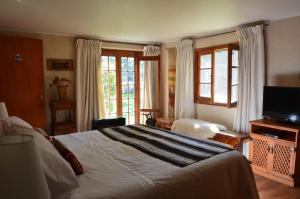 Ένα ή περισσότερα κρεβάτια σε δωμάτιο στο Villaguay B&B