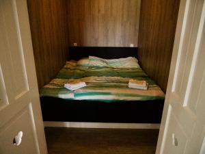 Postel nebo postele na pokoji v ubytování B&B “Te Warskip bij BlokVis”
