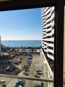 a view from a window of a parking lot at Apartment Orbi Plaza Batumi in Batumi