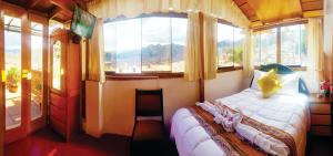 Postel nebo postele na pokoji v ubytování Hostal Comarca Imperial