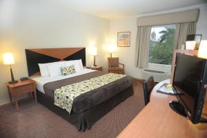 Postel nebo postele na pokoji v ubytování Sleep Inn Paseo Las Damas + 26 fotografií