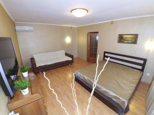 a bedroom with two beds in a room at Apartment Grand Kazan on Chetaeva 28 in Kazan
