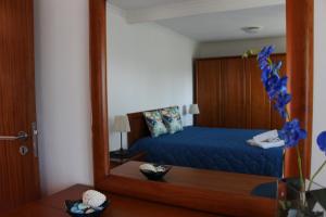 Tempat tidur dalam kamar di Casa do Facho
