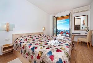 Postel nebo postele na pokoji v ubytování Apartments Figarola