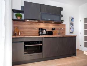 Kuchyň nebo kuchyňský kout v ubytování Apartments Figarola