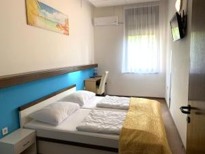 Voodi või voodid majutusasutuse Hotel Ruža toas