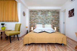 Postel nebo postele na pokoji v ubytování Apartments Figarola