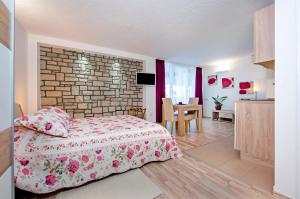 Kuchyň nebo kuchyňský kout v ubytování Apartments Figarola