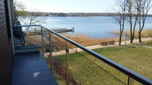 a view of a lake from a balcony of a house at U Hanusi in Ostróda