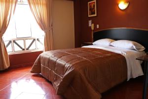 Hotel Bohemia 객실 침대