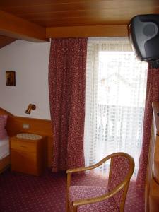 מיטה או מיטות בחדר ב-Garnì Conturina