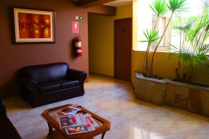 Uma área de estar em Hotel Bohemia