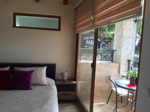 a bedroom with a bed and a table with a chair at Apartments Antigona Old Town in Ulcinj