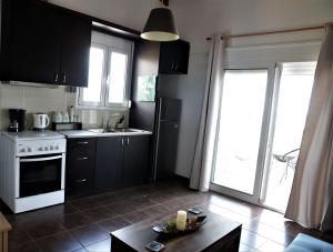Kuchyň nebo kuchyňský kout v ubytování Havana 1 Sea and Pool Apartment