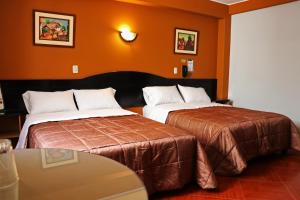 Cama ou camas em um quarto em Hotel Bohemia