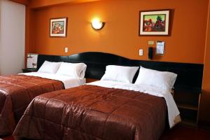 Cama ou camas em um quarto em Hotel Bohemia