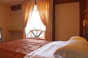 Cama ou camas em um quarto em Hotel Bohemia