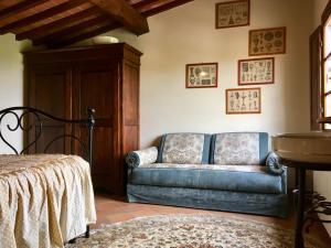a living room with a couch and a table at Agriturismo La Palazzina in Palaia