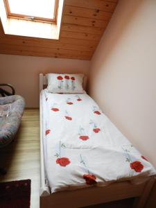 Posteľ alebo postele v izbe v ubytovaní Domek Letni Ryn