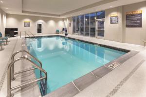 a large swimming pool in a hospital at La Quinta by Wyndham Terre Haute in Terre Haute
