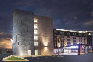 a rendering of a building at night at La Quinta by Wyndham Winchester in Winchester