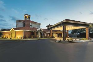 a large building with a clock tower on top of it at La Quinta by Wyndham Shreveport Airport in Shreveport