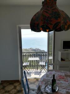 a dining room with a view of the ocean at casa fiorella in San Bernardino