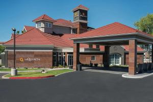 a building with a clock tower on top of it at La Quinta by Wyndham Phoenix Chandler in Phoenix