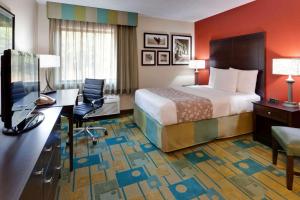 A bed or beds in a room at La Quinta by Wyndham Plattsburgh