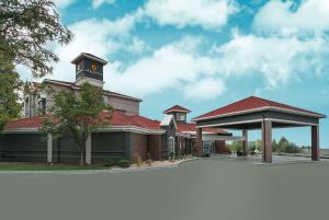 a building with a clock tower on top of it at La Quinta by Wyndham Orem University Pwy Provo in Orem