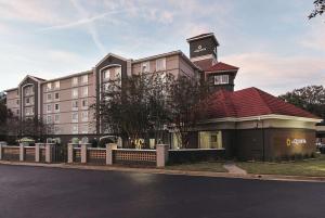 a building with a clock tower on top of it at La Quinta by Wyndham Atlanta Conyers in Conyers