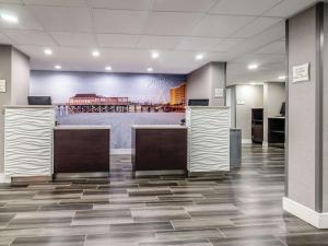 a lobby with a mural of a ballpark at La Quinta by Wyndham Myrtle Beach - N. Kings Hwy in Myrtle Beach +37 photos