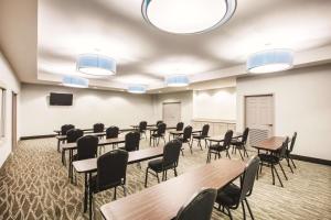 a large room with tables and chairs and lights at La Quinta by Wyndham Mansfield TX in Mansfield +24 photos