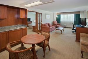 a living room with a kitchen and a room with a table at La Quinta by Wyndham Downtown Conference Center in Little Rock