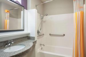 a bathroom with a sink and a shower at La Quinta by Wyndham Fort Walton Beach in Fort Walton Beach