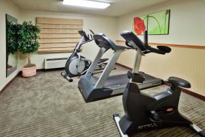 a gym with two exercise bikes in a room at La Quinta by Wyndham Savannah Southside in Savannah