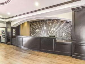 a lobby of a store with a glass wall at La Quinta by Wyndham Fort Worth - Lake Worth in Fort Worth