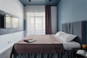 a bedroom with a bed with a book on it at WELCOME summer in Zatoka +99 photos