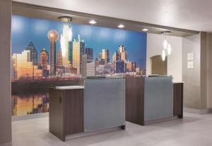 a city skyline mural on a wall in a room at La Quinta by Wyndham Corsicana in Corsicana +18 photos