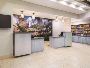 a lobby of a store with a mural on the wall at La Quinta by Wyndham Fresno Northwest in Fresno