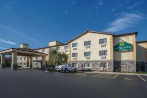 a hotel with a truck parked in front of it at La Quinta by Wyndham Erie in Erie