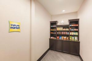 a walk in pantry at a store at La Quinta by Wyndham Houston IAH Bush Intl Airport E in Humble