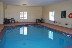 a large swimming pool in a building at La Quinta by Wyndham Fairfield TX in Fairfield